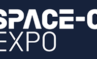 The Space-Comm Expo logo features bold white text and a circular icon with blue and pink gradients on a dark background.