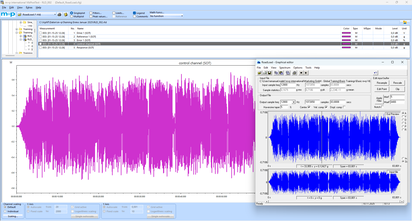 A software interface displays colorful waveform graphs, illustrating realistic reproduction on a shaker system.