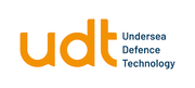 The image shows the "UDT" logo in orange with "Undersea Defence Technology" written in blue beside it.
